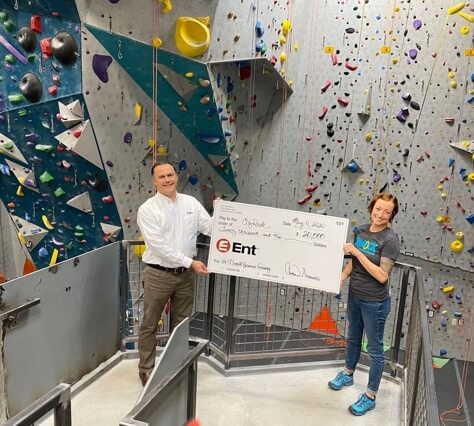 Ent Credit Union donating check to City Rock
